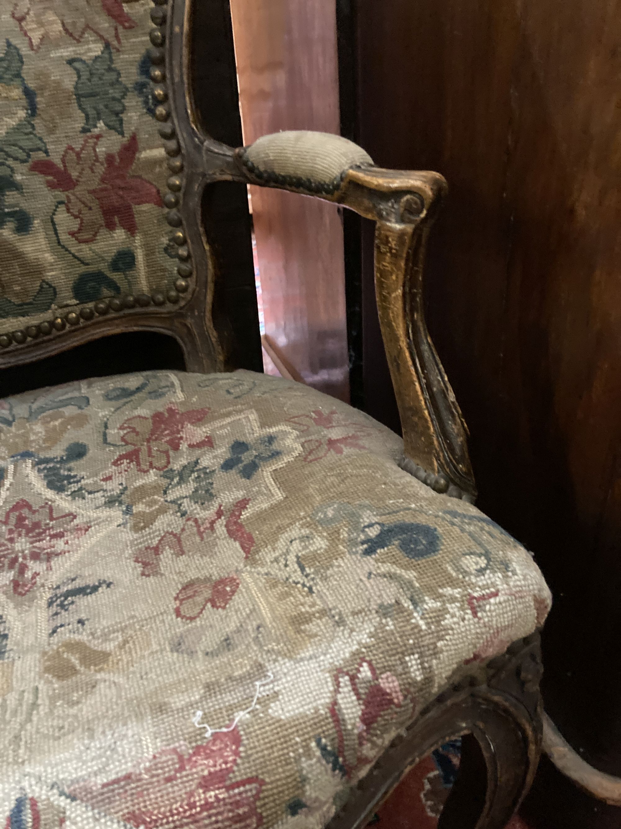 A Hepplewhite style mahogany armchair and a Louis XV walnut fauteuil covered in tapestry